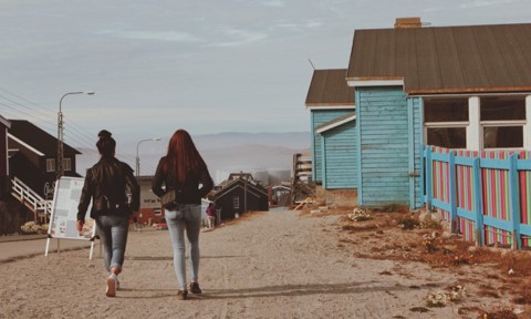 Two women stroll in Ilulissat, Greenland 