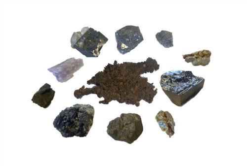 Siv Årsand, A Materials Library for the Digital World, 2023, Installation; Minerals, digital devices, wooden shelves.