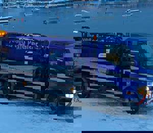 Trucked sewer service in Greenland with a sense of humor. Text on truck translates: “best sausages in town”.