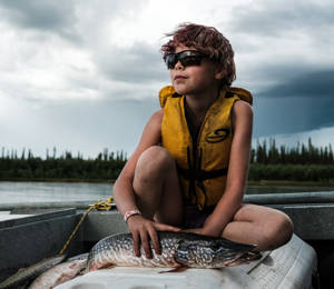 Inuvik Girl Poses For A Photo With A Pike She Caught In The East Branch Of The Mackenzie River Delta