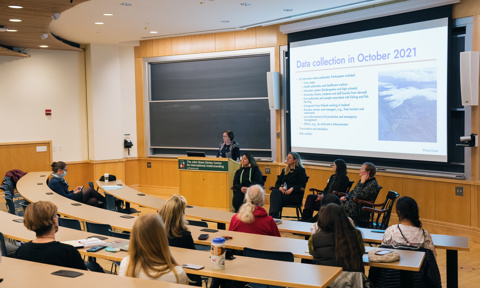 COVID Panel - Dr. Lára Jóhannsdóttir at the podium (Iceland), left to right on the chairs: Dr. Gwen Healey, Dr. CHristina VL Larsen (Denmark/Greenland); Dr. Katie Cueva (Alaska); Dr. Arja Rautio (Finland)